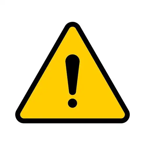 Industrial Warning Sign A yellow warning sign indicating a potential hazard or limitation.
